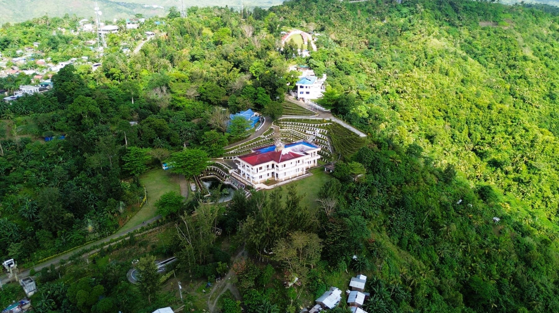 The PBMA Divine Master Shrine on a green hillside above San Jose
